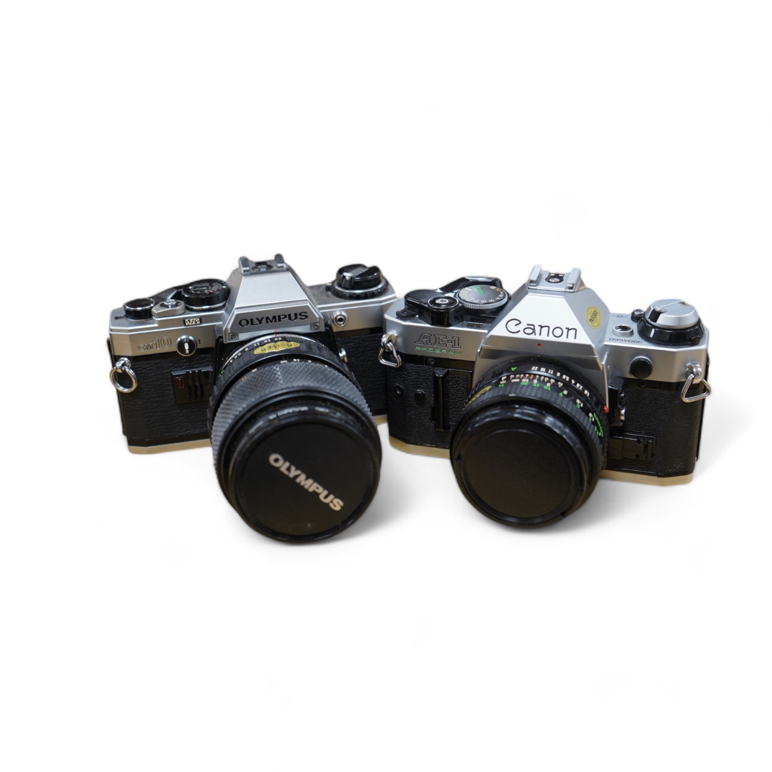 A quantity of various cameras and lenses to include Olympus, Minolta, Pentax and Canon. Condition - varies